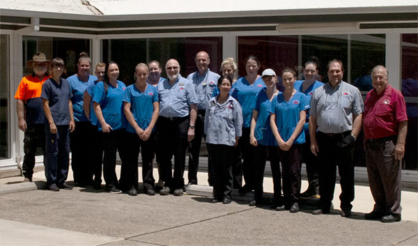 the staff of Rossmore Vet Centre standing in front of the vet clinic